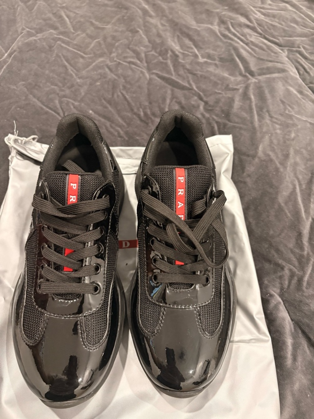 Prada Black Sneakers with Red Logo Stripe